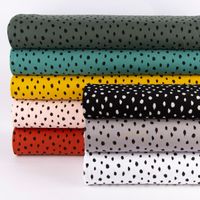 Bio-Sweatstoff Soft Sweat Kreise Tupfen grafisch ockergelb schwarz 1.5