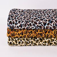 Bekleidungsstoff Pearl Peach Leoparden Muster ocker schwarz braun 1.44