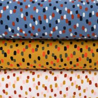 Sweatstoff Soft Sweat Tupfen Pinselstriche ocker grau schwarz orange 1