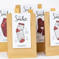 Weihnachtssocken mit verschiedenen Motiven in Umverpackung