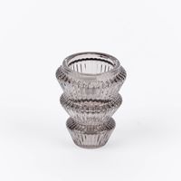 86228-Kerzenhalter-Tanne-fuer-Stabkerzen-aus-Glas-Rillen-6x8-5cm-grau-oder-transparent-DSC-9103.jpg Grauer Kerzenhalter aus Glas als Teelichthalter