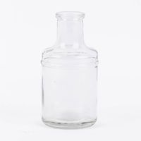 87362-Kleine-Vase-Flaschenform-zylinderfoermig-transparent-Glas-verschiedenen-Farben-6-5x13cm-DSC-8294-02.jpg Vase in flaschenform farblos