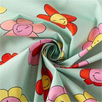 Tischdeckenstoff abwaschbar Baumwollstoff beschichtet HAPPY FLOWERS lachende Blumen mint grün rosa gelb 1,45m Breite gedreht