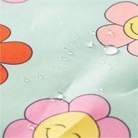 Tischdeckenstoff abwaschbar Baumwollstoff beschichtet HAPPY FLOWERS lachende Blumen mint grün rosa gelb 1,45m Breite mit Wasserperlen
