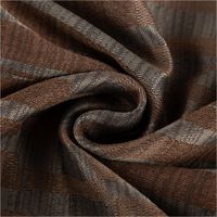 Der hochwertige Vorhangstoff Jacquard Stoff Linux Braun und Grau 154cm Breite überzeugt durch sein modernes Webmuster. Ideal für zeitlose Fensterdekorationen und langlebige Heimtextilien - kunstvoll eingedreht in Falten
