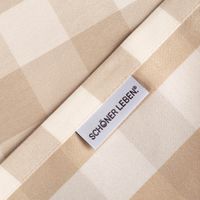 Markenetikett des Tischläufers Karos beige weiß von SCHÖNER LEBEN., steht für Qualität und stilvolle Wohntextilien.