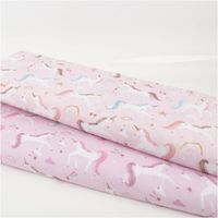 Baumwollstoff in zartem Nude-Rosé mit verspieltem Einhorn-Print, Sternen, Regenbögen und Kirschen – exklusives Design aus Frankreich für Kinderprojekte -in Kombination mit anderem Stoff praesentiert