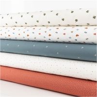 Jersey Stoff Baumwolljersey mit kleinen Puzzleteilen – Weich, elastisch & hautfreundlich in Wollweiß (/1,50 m Breite) schraege Ansicht des in Szene gesetzten Stoffes