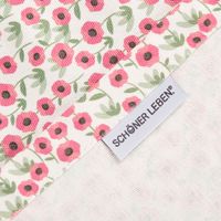 Rückseite der Baumwoll-Tischdecke mit Mini Blumen, Webstruktur und eingenähtes SCHÖNER LEBEN Label sichtbar