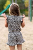 Jerseystoff aus Baumwolle mit klassischem Leopardenmuster in Schwarz auf beigefarbenem Hintergrund, dehnbar und angenehm für Bekleidung geeignet - Rueckansicht Kleid