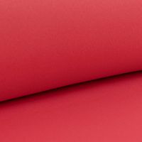 Detailansicht einfarbiger Verdunklungsstoff grenadine rot, locker aufgerollt.