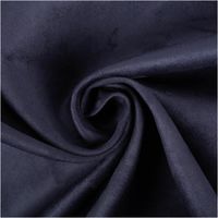 Mikrofaser Polsterstoff in Uni Navy Blau. Weich, langlebig und pflegeleicht – perfekt für Polstermöbel, Kissen und vielseitige Wohnaccessoires - kunstvoll eingedreht in Falten