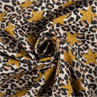 Baumwollstoff Popeline mit Leopardenmuster in Beige, Braun und Schwarz, verziert mit auffälligen goldfarbenen Glitzer-Sternen - kunstvoll eingedreht in Falten