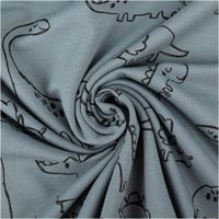 Blauer French Terry Sommersweat mit schwarzen Dinosaurier-Motiven, weicher Stoff mit Schlingenstruktur, ideal für Kinderkleidung - kunstvoll eingedreht in Falten
