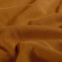 Detailaufnahme karamellfarbener Baumwoll-Strickstoff, heavy knit, weiche Maschenstruktur, leicht gewellt gelegt