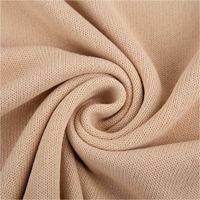93147-Strickstoff-aus-100--Baumwolle-in-Beige-135cm-Breite--IMG-1381.jpg Strickstoff aus 100 % Baumwolle in elegantem Beige, 135 cm breit – natürlich, weich und perfekt für Pullover, Cardigans oder Wohntextilien - kunstvoll eingedreht in Falten