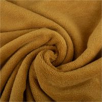 93249-Bambus-Fleece-Stoff-mit-Baumwolle-uni-Ockergelb-1-45m-Breite-IMG-2721.jpg Bambus Fleece Stoff mit Baumwolle in uni Ockergelb. Detailansicht der weichen, saugfähigen und flauschigen Oberfläche, 1,45m breit - kunstvoll eingedreht in Falten
