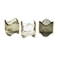 93287-Teelicht-grau-oder-transparent-5-7x6-2cm-von-Werner-Voss-Screenshot-2025-11-16-192343.jpg Drei Glas-Teelichthalter in organischer Form in Transparent und Grautönen von Werner Voß