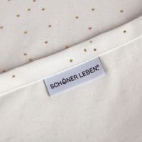 93408-SCHoeNER-LEBEN--Tischlaeufer-aus-Baumwoll-Canvas-in-Weiss-mit-Goldpunkten-40x160cm-IMG-3537.jpg Nahaufnahme des weißen Canvas-Stoffs mit feinen goldenen Punkten.
