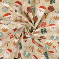 Gedrehter Stoff aus Baumwoll-Canvas mit Weihnachtsmotiven in Rot und Grün