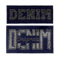 93522-Applikation-Label-Denim-jeansblau-von-Prym-Screenshot-2026-01-03-141828.png Zwei bestickte Denim-Labels in Jeansblau in unterschiedlichen Größen auf weißem Hintergrund