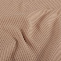 Rippjersey aus Baumwolle in Uni Nude mit feiner Rippenstruktur, leicht gewellt gelegt