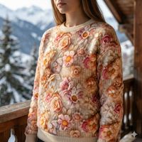 Der weiche Alpenfleece Stoff Digitaldruck Strickoptik Blüten wollweiß rosa 1,50m Breite überzeugt durch sein realistisches Blumenmuster. Ideal für wärmende Pullover, gemütliche Decken oder winterliche Accessoires - Nahaufnahme des in Szene gesetzten Stoffe