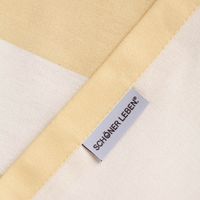 Rückseite der Baumwoll-Tischdecke Vanille Ecru mit angenähtem SCHÖNER LEBEN Label und sauberer Verarbeitung.