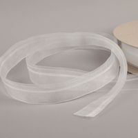 94197-Gerster-Stangeneinschubband-42mm-transparent-fuer-Vitragenstange-oder-Stabilisierungsstab-IMG-0674.jpg Transparentes Stangeneinschubband von Gerster mit einer Breite von 42 mm für die einfache Gardinenbefestigung. Es eignet sich ideal zum Einschieben von Vitragenstangen oder Stabilisierungsstäben und sorgt für einen gleichmäßigen Faltenwurf sowie einen sich
