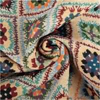 Bunter Gobelin-Dekostoff mit fein gewebtem Kelim-Patchworkmuster in Blau, Rot, Orange und Grün mit geometrischen Blüten und Rauten im Folkloredesign, 1,50 m breit - kunstvoll eingedreht in Falten