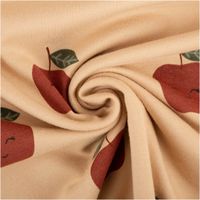 Weicher French Terry Sommersweat in 150 cm Breite mit Schlingenstruktur auf der Rückseite. Das Design zeigt rote Äpfel mit niedlichen Lachgesichtern und grünen Blättern auf beigem Grund. Ideal für bequeme Kinderbekleidung oder Freizeitmode - kunstvoll eing