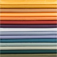 94725-Royal-Micro-Satin-Stoff-Meterware-rost-1-40m-Breite-IMG-4110.jpg Royal Micro Satin Meterware in warmem Rostton, 1,40 m breit – seidig glatte Oberfläche mit sattem Glanz im lebhaften Orange-Braun, als Rolle fotografiert, herb-warm und ausdrucksstark kombinierbar - mit weiteren Stoffen praesentiert