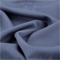 Viskosejersey mit Stretch in gedämpftem Jeansblau – uni, fein gewebt, weich fallend und angenehm elastisch. Breite: 1,40 m. Ideal für Kleider, Tops und Jerseymode - stilvoll drapiert