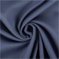 Viskosejersey mit Stretch in gedämpftem Jeansblau – uni, fein gewebt, weich fallend und angenehm elastisch. Breite: 1,40 m. Ideal für Kleider, Tops und Jerseymode - kunstvoll eingedreht in Falten