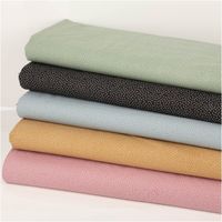 Baumwollstoff Popeline Stoff Pünktchen Serie Romantic Garden Altrosa 1,40m Breite Stapel von Baumwollstoffen in Pastellfarben mit kleinen weissen Punkten, Gesamtansicht der Stoffe.