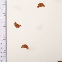 Jersey Stoff Baumwolljersey Croissant wollweiß braun 1,50m Breite Stoff mit Croissant-Motiv auf cremefarbenem Hintergrund, mit Meterstab zur Größeneinschätzung.