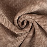 Detailaufnahme eines beigen Stoffes mit grober Webstruktur und spiralförmigem Faltmuster.