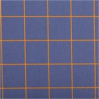 Kunstleder Happy Collection Karos dunkelblau ocker von Cherry Picking by Swafing Detailaufnahme eines blauen Stoffes mit orangefarbenem Karomuster und klaren Linien.