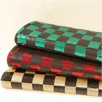 Paillettenstoff Karo Mesh Tüll Kostümstoff gold schwarz 1,25m Breite Paillettenstoff Karo in Smaragdgrün, Rot und Gold als gefalteter Stoffstapel