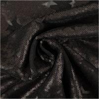 Paillettenstoff Sterne Mesh Tüll schwarz 1,25m Breite schwarzer Pailletten-Meshstoff mit Sternmotiven zur Spirale gedreht, Nahaufnahme des Materials