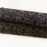 Paillettenstoff Ornamente Spitze silber schwarz 1,25m Breite zwei Stoffballen mit schwarzer Spitze und glitzernden Ornamenten, silberner und goldener Farbton, übereinandergelegt