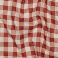 Nahaufnahme des Vichy-Karos in Rot und Apricot auf weißem Grund.