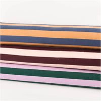 Sommersweat French Terry Streifen dunkelgrün rosa 1,48m Breite drei aufeinanderliegende Stoffrollen aus French Terry mit verschiedenfarbigen Streifen, Rolle ganz sichtbar