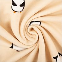 Sweat Stoff Pinguine beige, zur Spirale gedreht