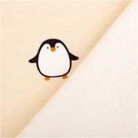 Sweat Stoff Pinguine beige: Vorderseite und angeraute helle Innenseite im Vergleich