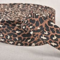 Gurtband Leopardenmuster braun schwarz 3,8cm Breite Gurtband mit Leopardenmuster in Braun und Schwarz, 3,8 cm breit, aufgerollt