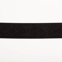 Gummiband Glitzer Rauten geometrisch schwarz silber 4cm Breite Breites schwarzes Gummiband mit Rautenstruktur, flach fotografiert vor weißem Hintergrund