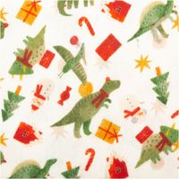 Detailaufnahme eines Weihnachtsstoffs mit Dinosaurier-, Geschenk- und Schneemannmotiven in Gruen und Rot.