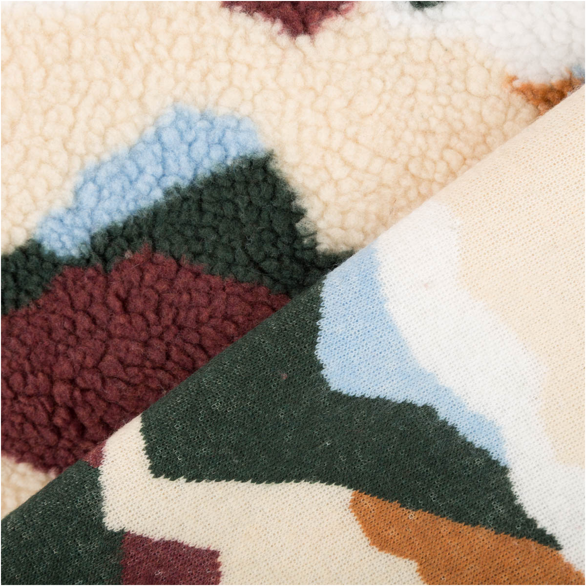 Teddy Stoff Sherpa Fleece abstrakte Wellen bordeauxrot bunt 1,50m Breite Sherpa Fleece Vorder- und Rückseite mit abstrakten Wellen in bordeauxrot, grün, creme, blau und orange