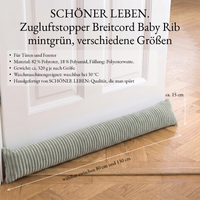 Zugluftstopper aus Breitcord in Mintgrün an der Tür auf Parkett, Maßangaben: 80 bis 130 cm lang, ca. 15 cm hoch Zugluftstopper aus Breitcord in Mintgrün an der Tür auf Parkett, Maßangaben: 80 bis 130 cm lang, ca. 15 cm hoch
